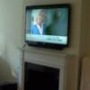 Wall Mounted TV w/ Soundbar wall mounted underneath (Pic 2 of 3)