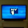 Wall Mounted TV w/ Soundbar wall mounted underneath (Pic 3 of 3)